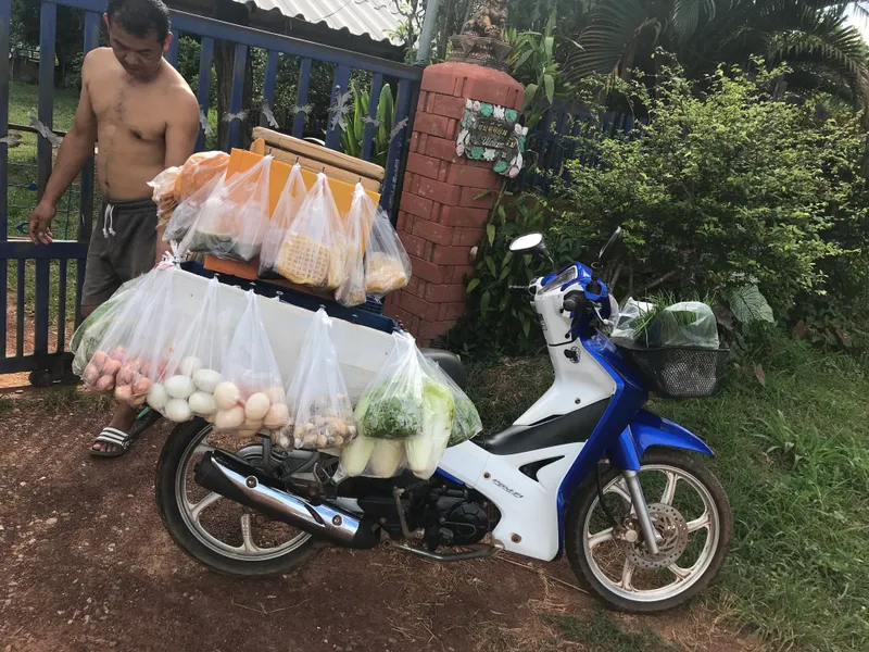 Fresh produce arriving by motorbike